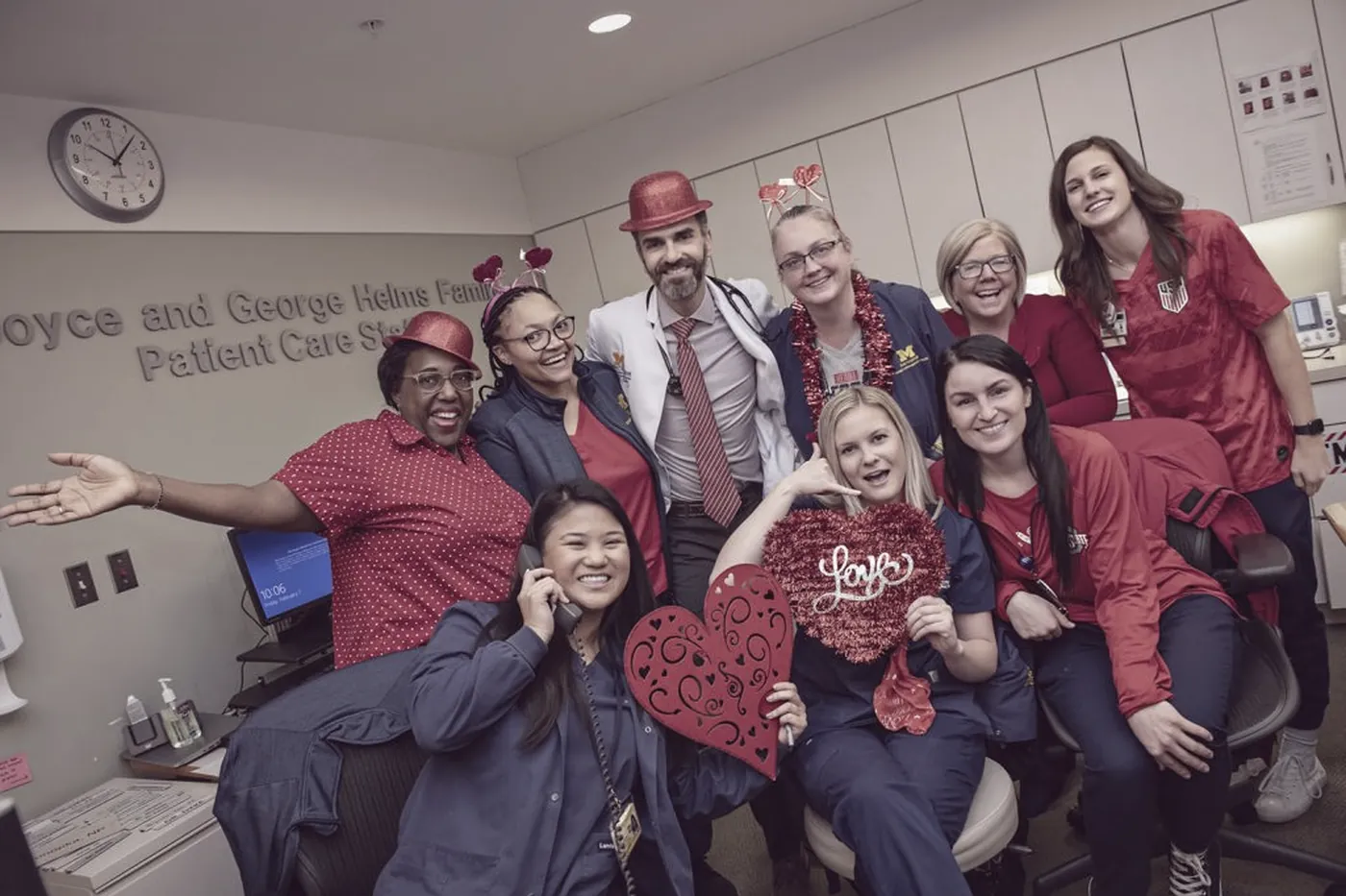 Clinical staff dressed in red with heart decorations for Go Red for Women
