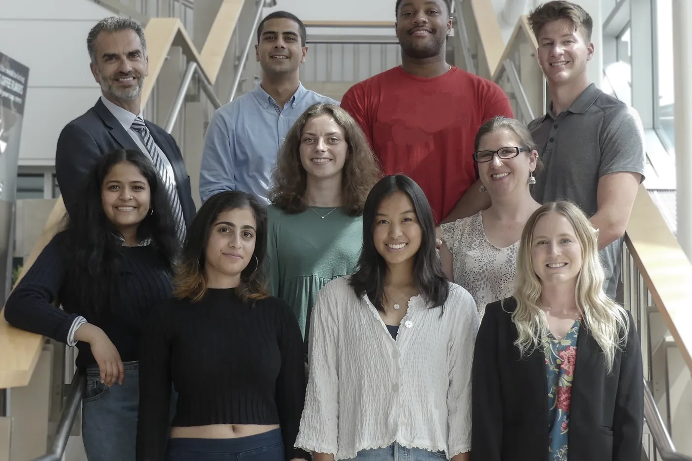 Lab members arranged on a stairwell for a group photograph