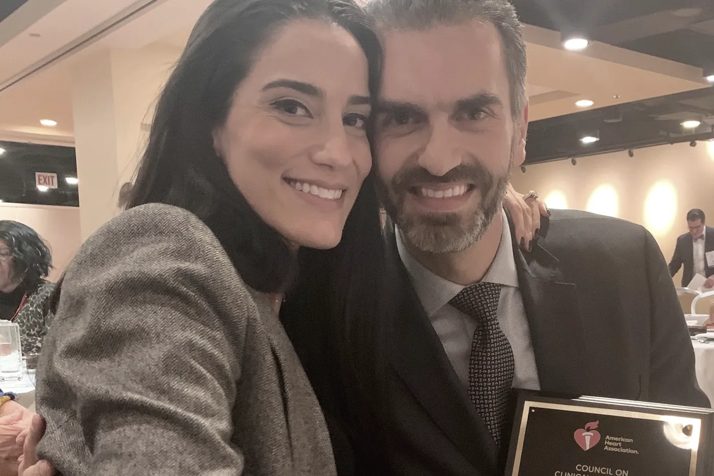 Salim Hayek holding the American Heart Association Samuel A. Levine Early Career Clinical Investigator Award plaque
